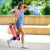 Scooter Micro Maxi Deluxe Plegable Led en color rosado para niños en uso