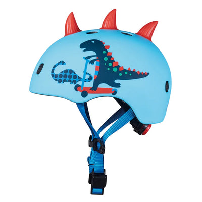 Casco infantil con temática de dino en 3D, marca Micro, ideal para proteger durante el uso de scooter o bicicleta.